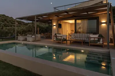 a house with a swimming pool in the yard at Seaview villa with pool in nature next to Platanias in Plataniás
