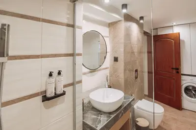 a bathroom with a sink and a toilet and a mirror at Santa Lucia - Cozy City Studio in Central Chania in Chania Town