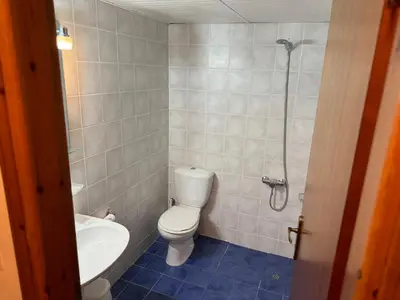 a bathroom with a toilet and a sink and a shower at Michalis Studios & Aparntments in Palaiochóra