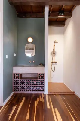 a bathroom with a sink and a shower at Qualia Slowlife Suites in Chania Town