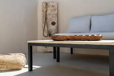 a bed sitting on a table in a room at Delta-Rho in Kalami