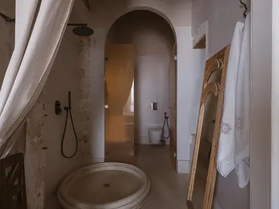 a bathroom with a large tub in a room at Aisha Hotel in Chania Town