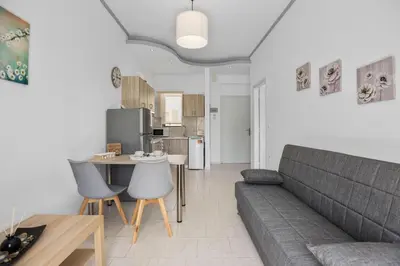 a living room with a couch and a table at Seafront Apartment in Chania 7 in Chania Town