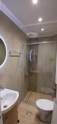 a bathroom with a shower and a toilet and a sink at Seafront Apartment in Chania 7 in Chania Town