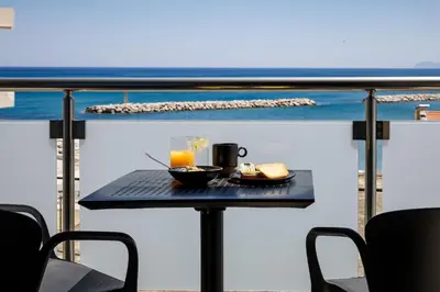 a table with a tray of food and a drink at Iria Sea View Room in Kolymvari