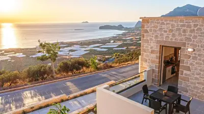 a view of the ocean from the balcony of a house at Rosmari Studios in Falasarna
