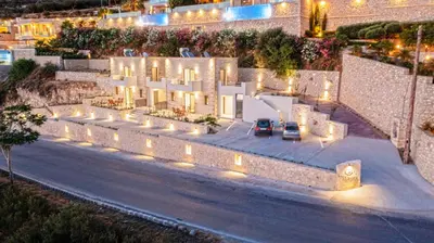 a house with lights on the side of a street at Rosmari Studios in Falasarna