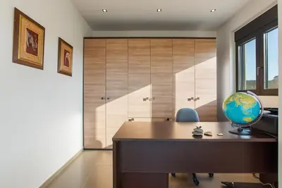 a office with a desk with a globe on it at Dream's House - Villa with Pool & Stunning Views in Daratso