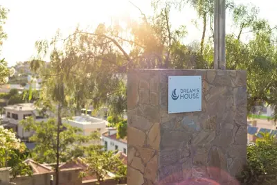 a stone pillar with a sign that reads flowersulse at Dream's House - Villa with Pool & Stunning Views in Daratso