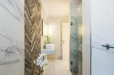 a bathroom with a shower and a sink at Harmony Villa in Chania Town