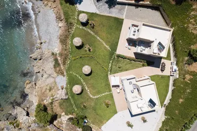 an aerial view of a house next to the ocean at Harmony Villa in Chania Town