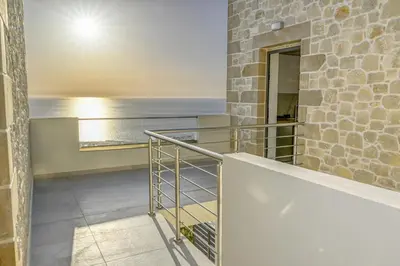 a balcony with a view of the ocean at Studios Rosmari in Áyioi Pándes