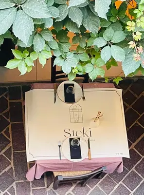 a dresser with two glasses and a table with at Steki Luxury Room 1 in Chania Town