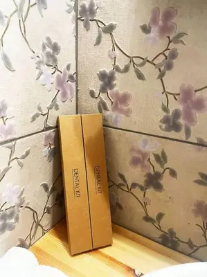 two books sitting on a shelf with flowers on a wall at Steki Luxury Room 1 in Chania Town