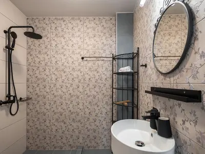 a bathroom with a sink and a mirror at Steki Luxury Room 2 in Chania Town