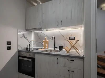 a kitchen with a sink and a counter top at Steki Luxury Room 2 in Chania Town