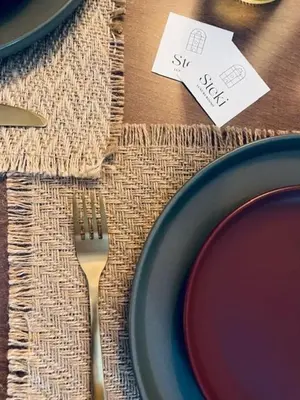 a table with a plate and a fork and a price tag at Steki Luxury Room 2 in Chania Town