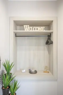 a window shelf with a welcome sign on it at Petra's Charming Home, 500m to Beach in Chania Town