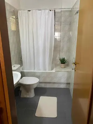a bathroom with a toilet and a tub and a sink at Eolia apartment in Chania with Sea&City View in Chania Town