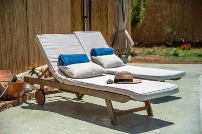 a beach chair with a hat on top of it at Eco Olive Treehouse in Chania Town