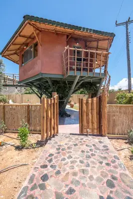 a house that is sitting on top of a fence at Eco Olive Treehouse in Chania Town