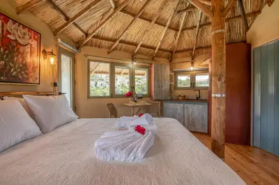 a bedroom with a bed with towels on it at Eco Olive Treehouse in Chania Town
