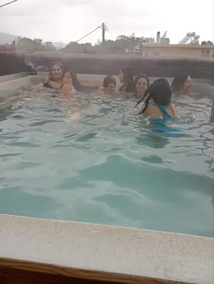 a group of women in a swimming pool at Thearia villa II private heated hydromassage pool in Souda