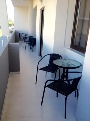 a row of chairs and tables in a building at Posto studio 3 Chania Crete 100m from the beach in Daratso