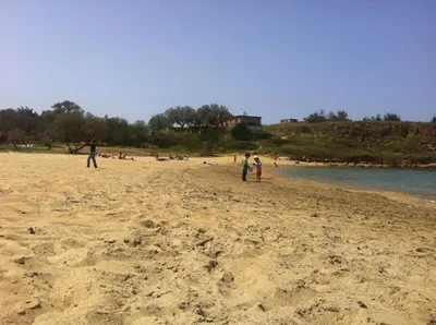 a group of people standing on a beach at Posto studio 3 Chania Crete 100m from the beach in Daratso