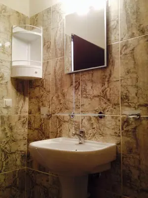 a bathroom with a sink and a mirror at Posto studio 3 Chania Crete 100m from the beach in Daratso