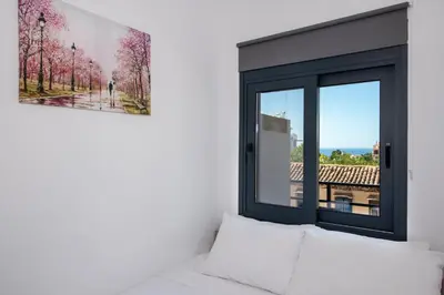 a room with a window and a bed with a view at Halepa Apartment's in Chania in Chania Town
