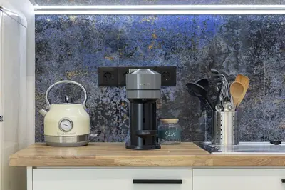 a coffee maker sitting on a wooden counter top at Beachfront luxury suite in Kalyves