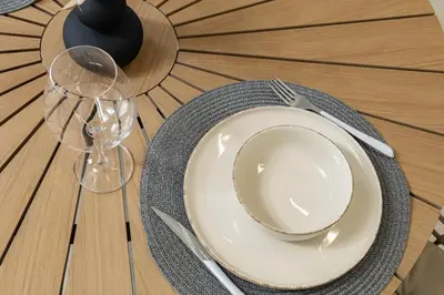 a table with a plate and a fork and knife at Beachfront luxury suite in Kalyves