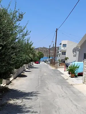 an empty street with trees on the side of a building at Sandy Suite 1 in Agia Marina Nea Kydonias