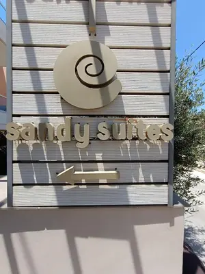 a sign for a scientology clinic on a building at Sandy Suite 1 in Agia Marina Nea Kydonias