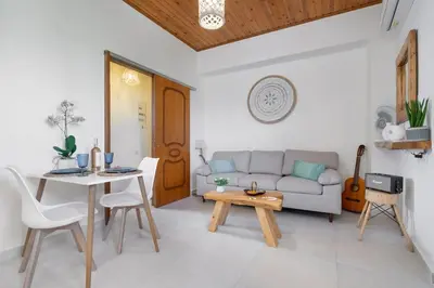 a living room with a couch and a table at Maestro House in Chania Town