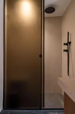a shower stall with a door in a bathroom at Monk Residence 27 - next to old Venetian Harbor in Chania Town