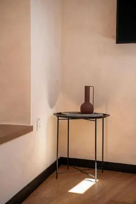 a vase sitting on a table in a room at Monk Residence 27 - next to old Venetian Harbor in Chania Town