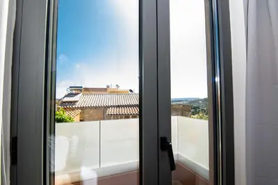 a sliding glass door with a view of a building at Filitsa's Luxury House in Chania Town