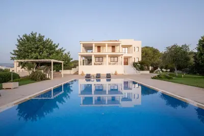 a house with a swimming pool in front of it at Fleur du sud - Villa in Chania in Korakiaí