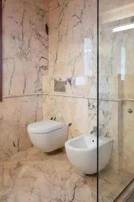 a bathroom with a sink and a toilet and a shower at Fleur du sud - Villa in Chania in Korakiaí