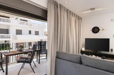a living room with a couch and a table at The Sandgate Elegant studio, Chania Seaside in Chania Town
