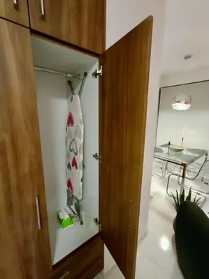 a closet with a neck tie in a room at Hermes Studio - In the city just steps to the sea! in Chania Town