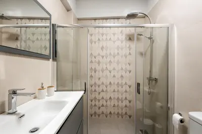 a bathroom with a shower and a sink at Newbulit Apartment 1km from the center of Chania in Chania Town