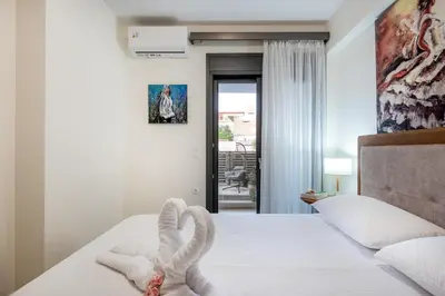 a bedroom with a bed with a heart made out of towels at Newbulit Apartment 1km from the center of Chania in Chania Town