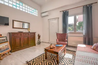 a living room with a couch and a table at Lavande in Chania Town