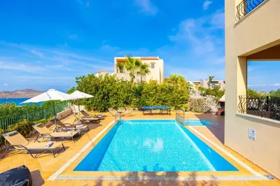 a swimming pool in a villa with a view of the ocean at Villa Pasiphae 1 in Stalos