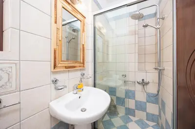 a bathroom with a sink and a shower at Villa Pasiphae 2 in Stalos