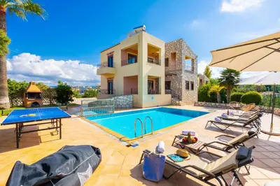 a villa with a swimming pool and a house at Villa Pasiphae 2 in Stalos