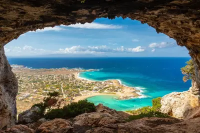 a view from a cave of a beach and ocean at Villa Pasiphae 2 in Stalos
